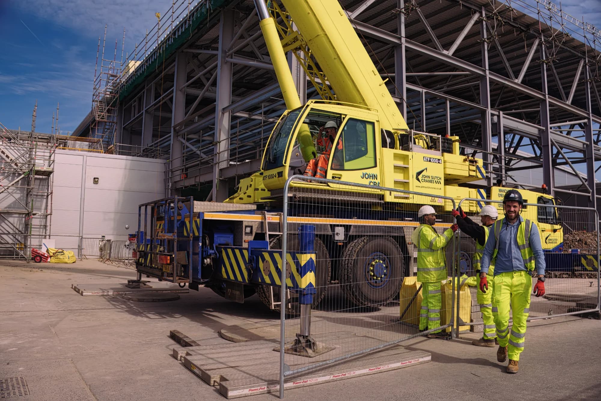 Mobile crane lifting steel at construction site - Professional LOLER compliant lift planning services UK
